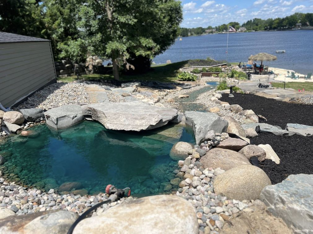 Custom backyard water feature and stone pond